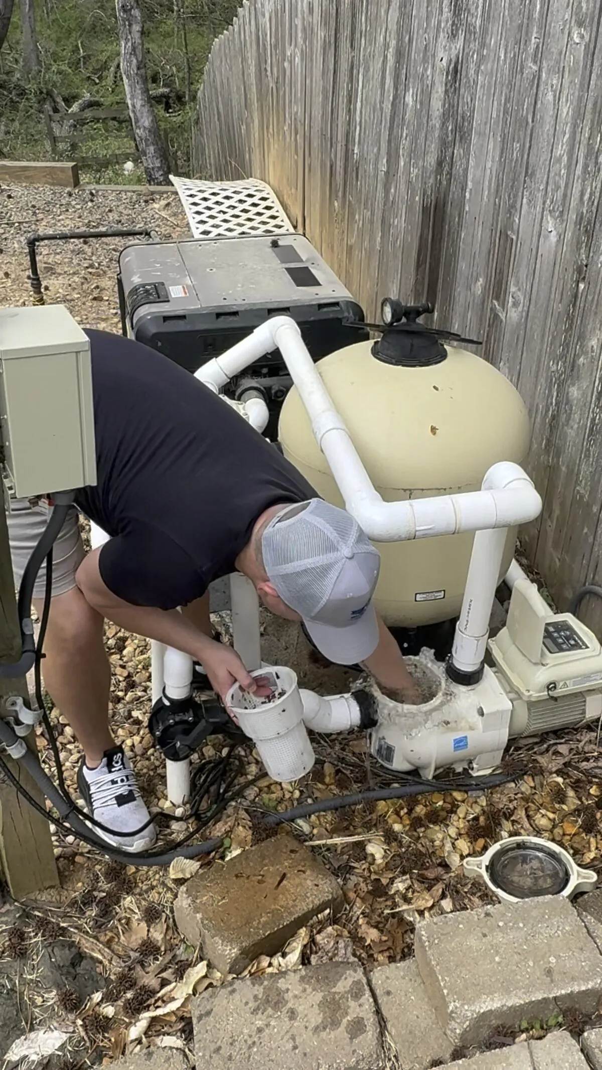 Corey servicing pool pump and filter equipment